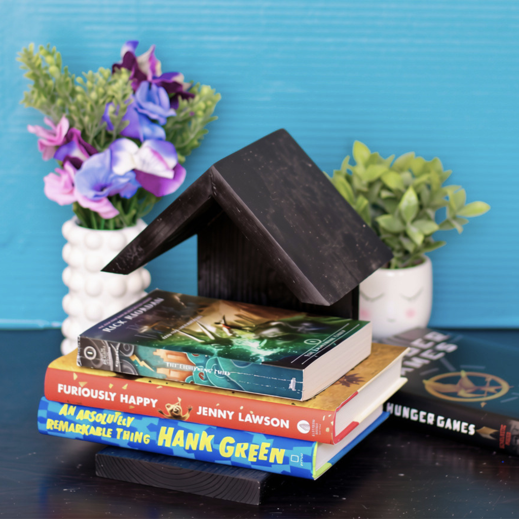 black modern wooden house shaped book holder with built in bookmark